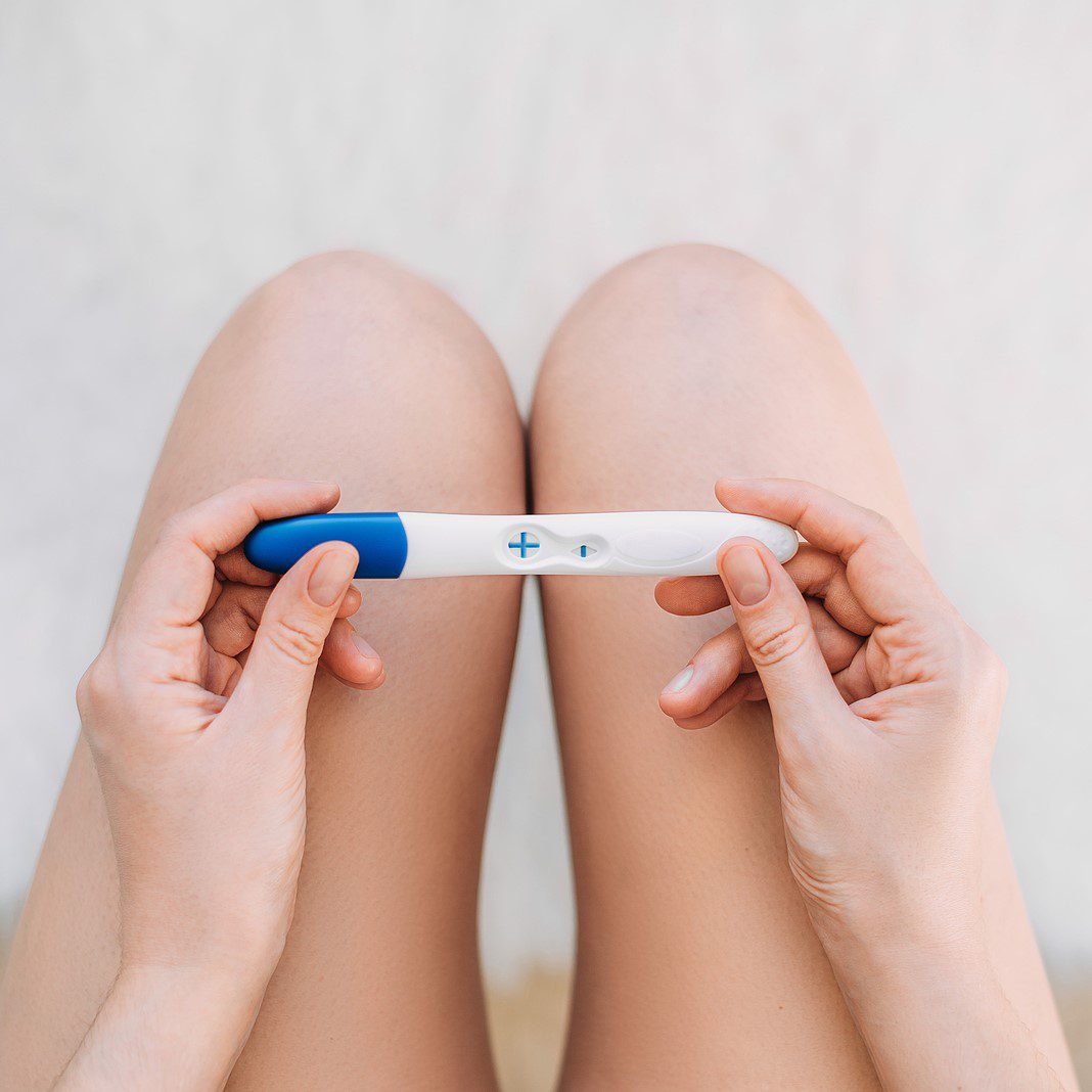 A woman holding a free pregnancy test in Branson West, Missouri