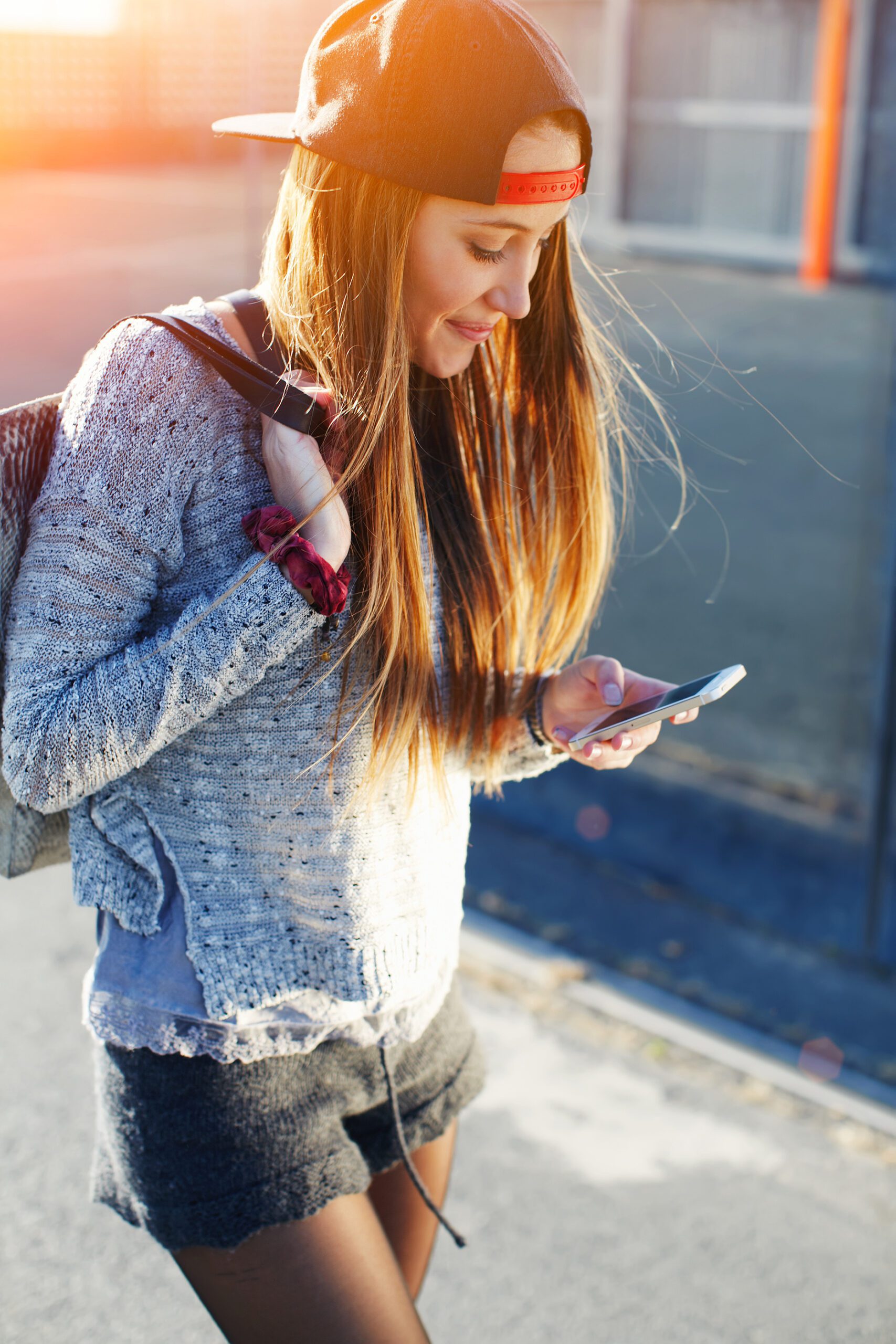 A woman searching on her phone for pregnancy support in Branson West, Missouri